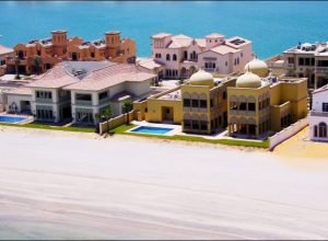 UNITED ARAB EMIRATES - FEBRUARY 01:  The Palm Islands, also referred to as The Palm Dubai and The Palms, are the three largest man-made islands in the world, which are being built on the coast of the emirate of Dubai, in the United Arab Emirates (UAE). Its concept was announced in May 2002 and the three resort islands are expected to maintain position as a premium tourist destination The Palm Islands is also the self-declared 'Eighth Wonder of the World'. Each of the islands (Palm Jumeirah, Palm Jebel Ali, and Palm Deira) are being built in the shape of a date palm tree and consist of a trunk, a crown with fronds, and are surrounded by a crescent island that acts as a breakwater. The islands will support luxury hotels, freehold residential villas, unique water homes, shoreline apartments, marinas, water theme parks, restaurants, shopping malls, sports facilities, health spas, cinemas and various diving sites in Dubai, United Arab Emirates on February 01, 2007.  (Photo by Alain BENAINOUS/Gamma-Rapho via Getty Images)